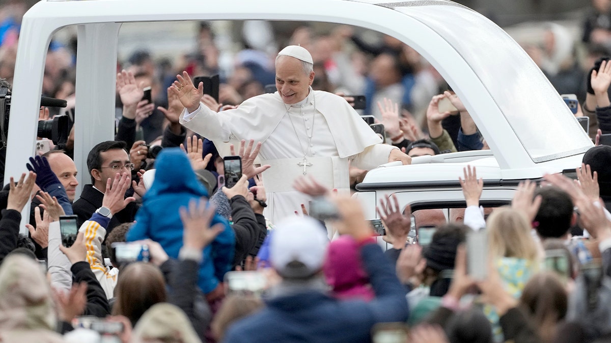 The pontiff greets the faithful in St. Peter’s Square.