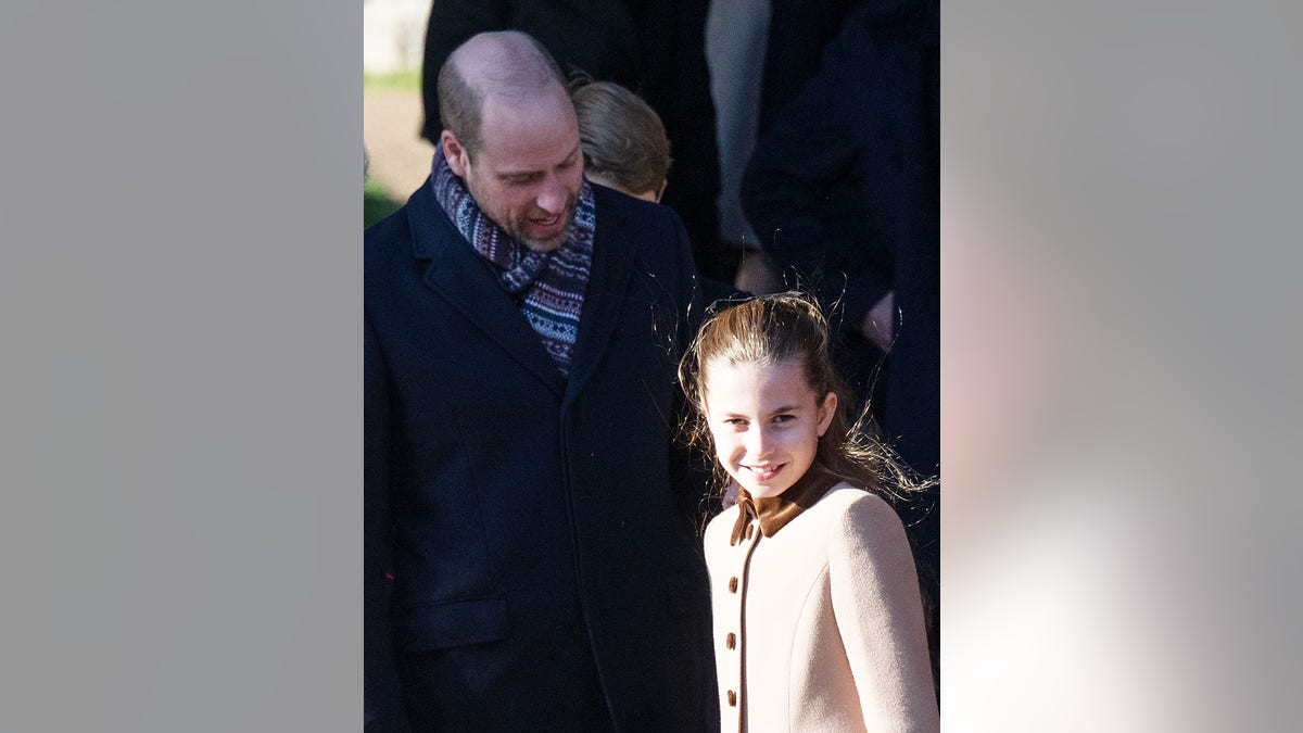 Prince William looking at his daughter Princess Charlotte.