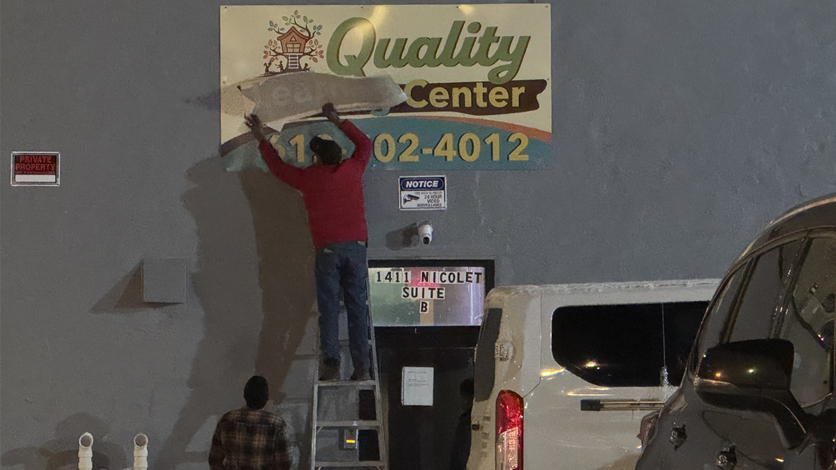 Quality Learning Center sign being corrected