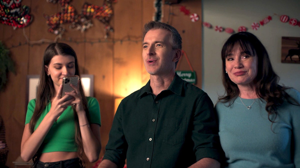 Jill Schoelen acting out a scene with two of her castmates in "Ralph's Perfekt Christmas."