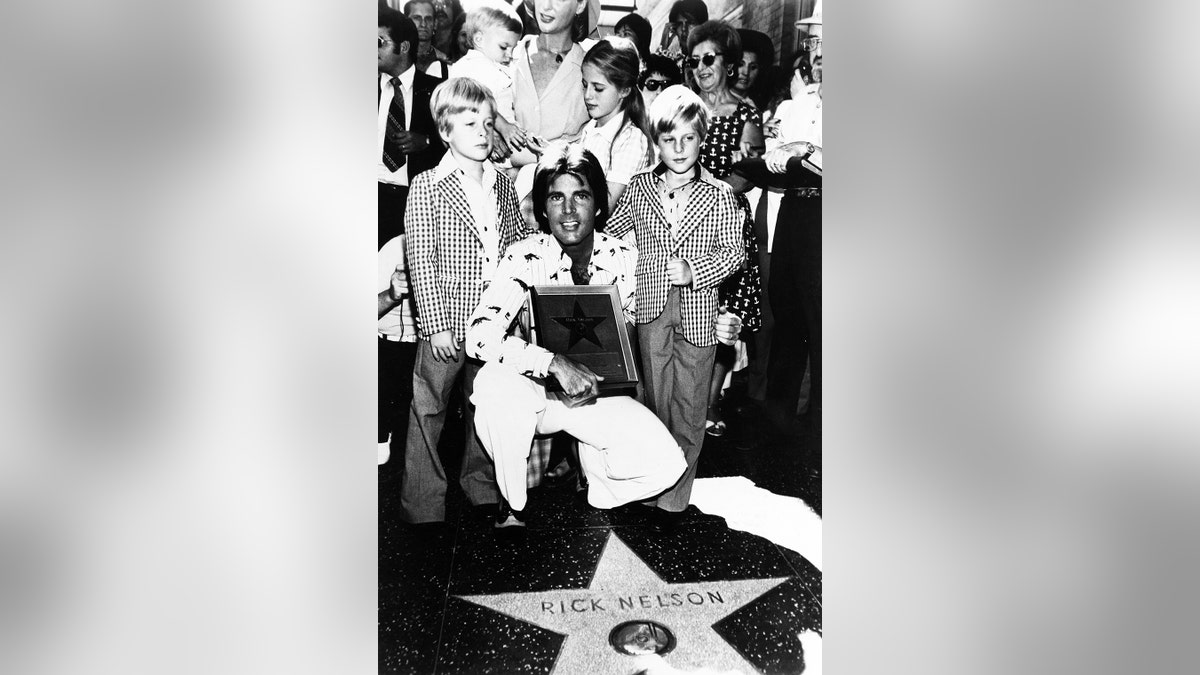 Ricky Nelson accepting a star on the Walk of Fame with his twin sons.
