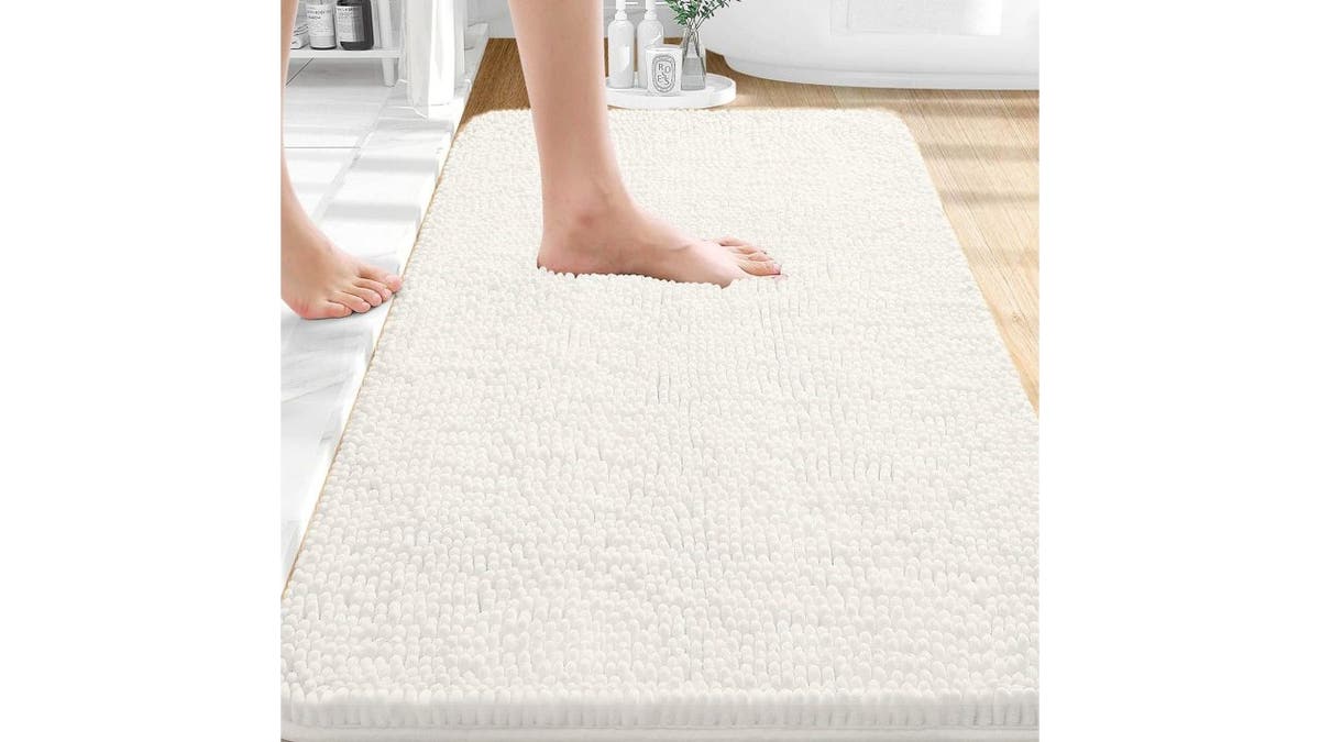 Swap out old bathroom rugs for something soft and plush.