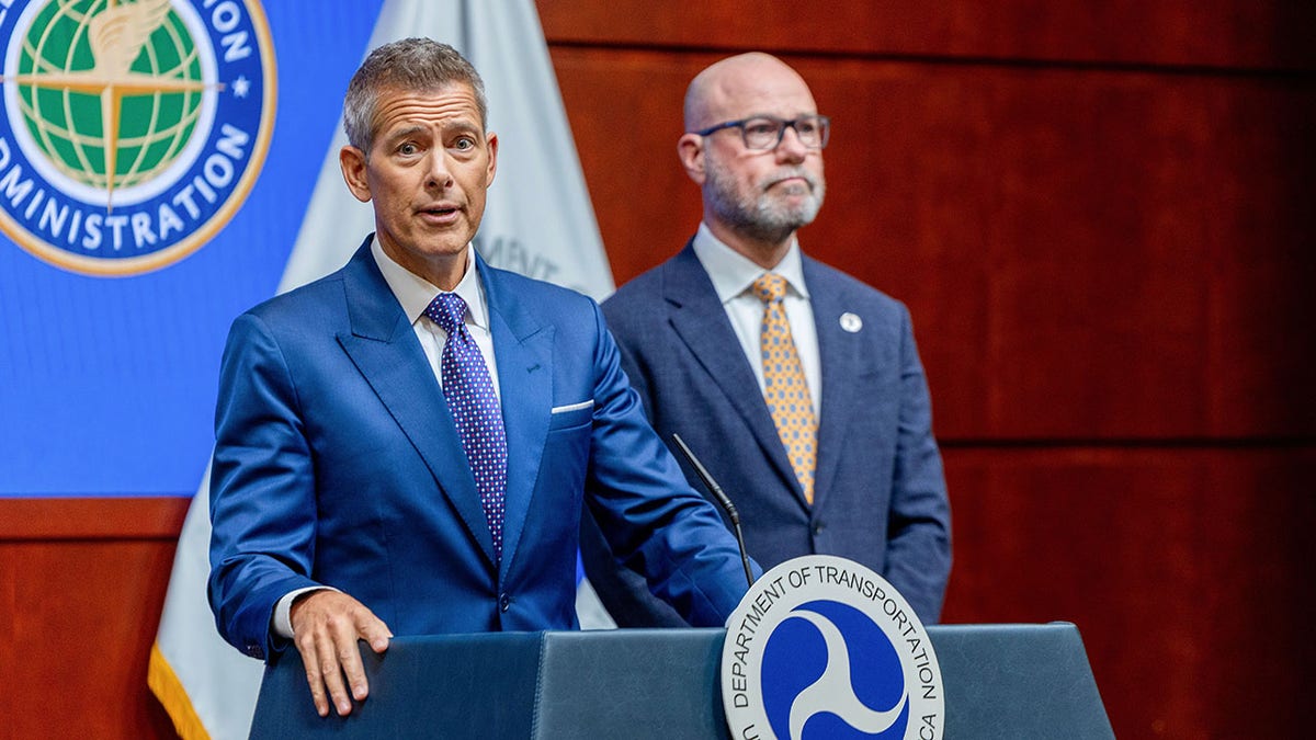 Sean Duffy and the FAA administrator speaking at a news conference