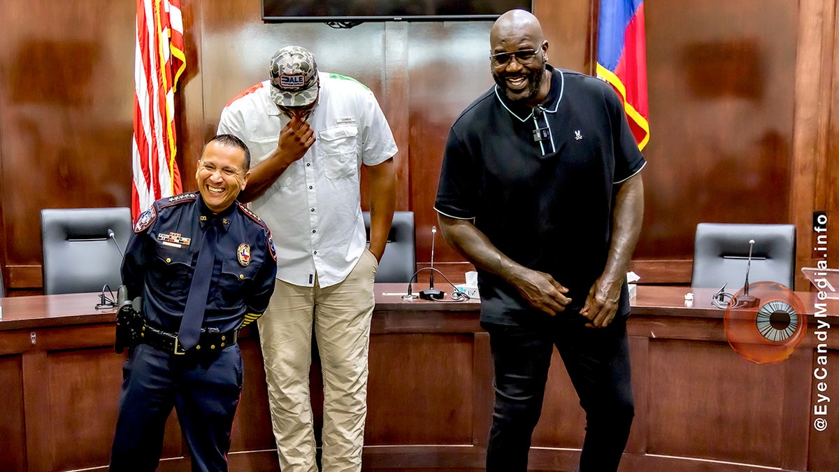 Shaquille O'Neal laughs