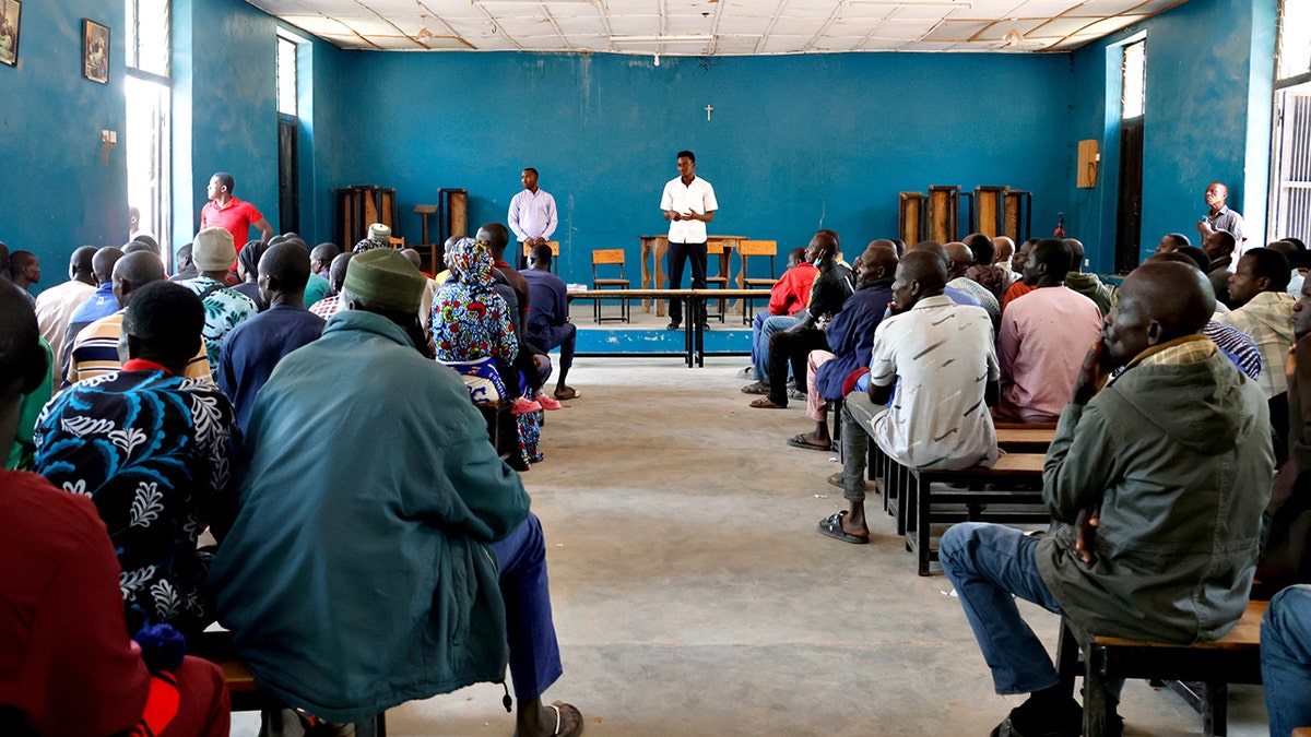 Parents of abducted school children sit in school