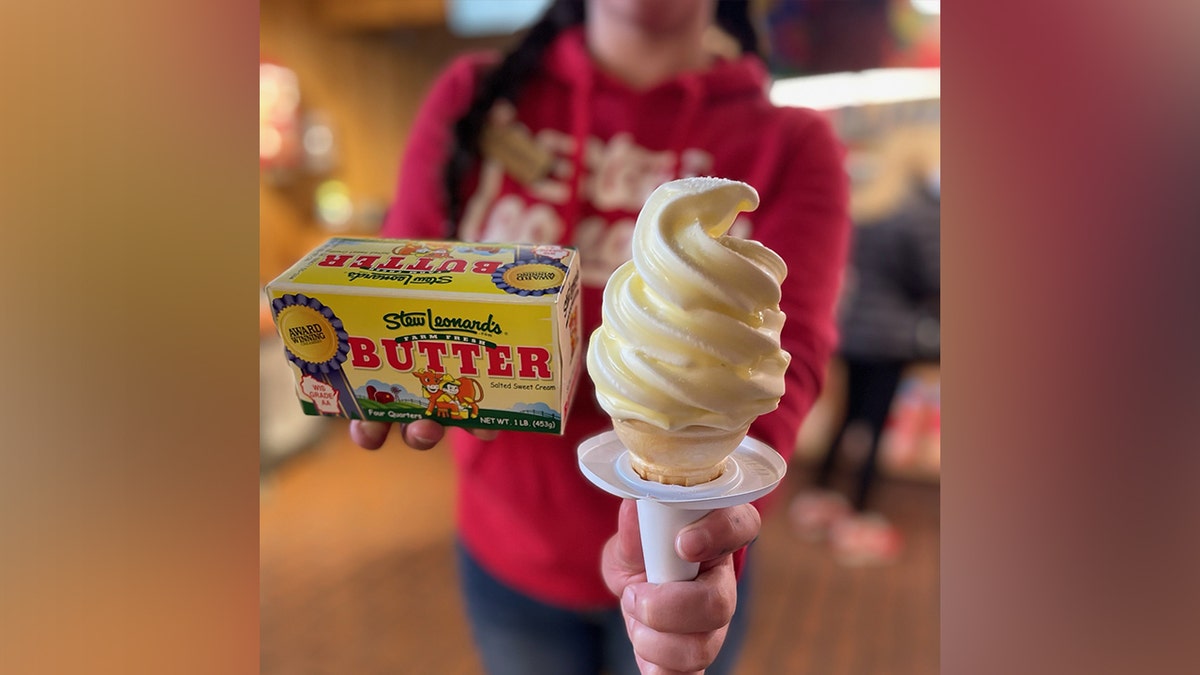 Employee holding butter, ice cream