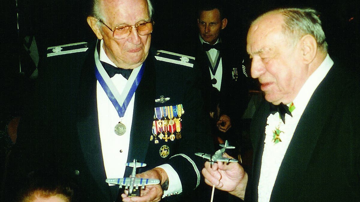 Pilot Charles Brown (wearing many medals) reunited with German pilot Franz Stigler on September 20, 1997.