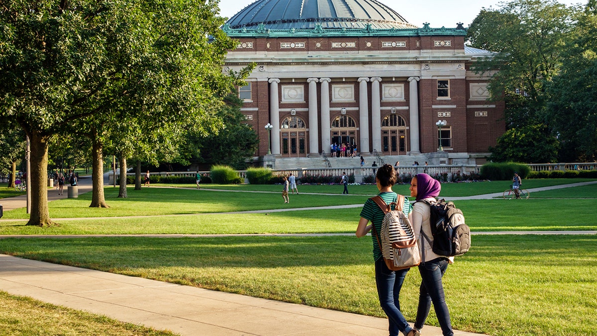 Students walking on campus on sunny day at University of Illinois Urbana-Champaign