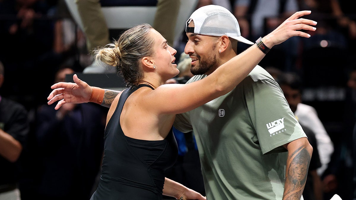 Aryna Sabalenka and Nick Kyrgios hug