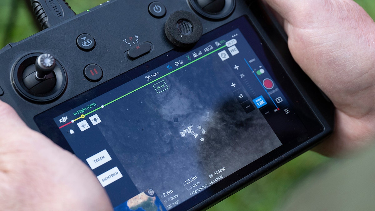 Hands using drone controller.