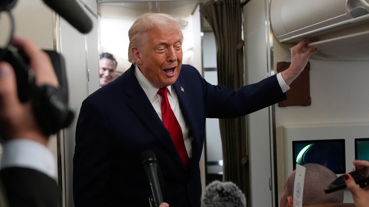 Trump talks to reporters after being hit with the AF1 bathroom door