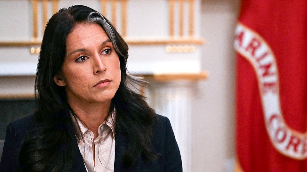 Director of National Intelligence Tulsi Gabbard listens as President Donald Trump speaks during a Cabinet meeting in the White House Cabinet Room in Washington, D.C., on Dec. 2.