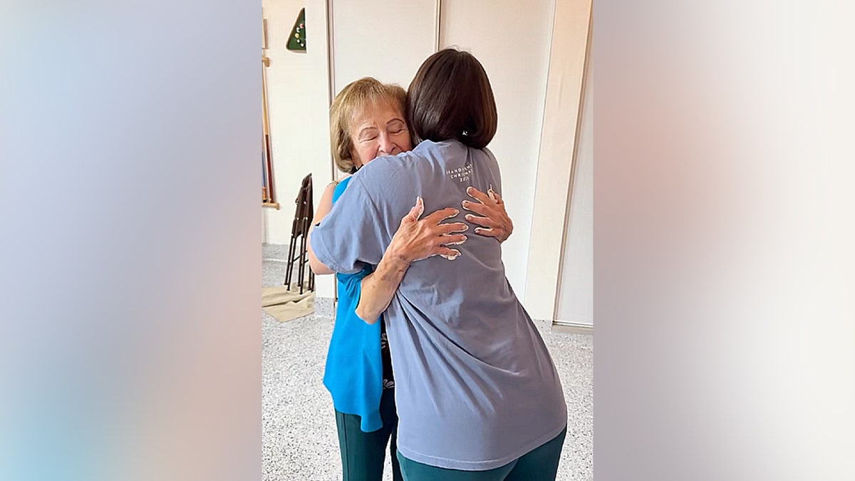 Toni Blackstock hugs family member