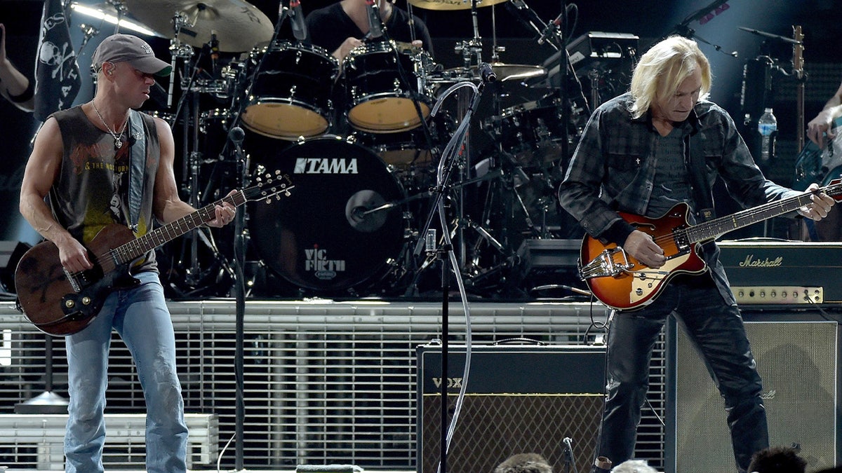 Kenny Chesney and Joe Walsh on stage