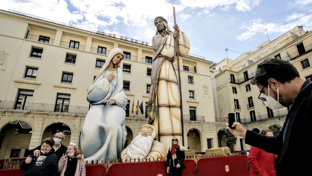 people looking at worlds largest nativity scene