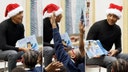Obama surprises Chicago students in Santa hat for holiday library story time reading session