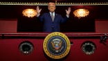 Trump raises hands from box in Kennedy Center