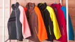 colorful fleece jackets on hangers