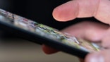 Person using their smartphone.