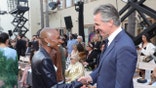 Newsom and Erivo shake hands