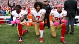 Colin Kaepernick kneels during the anthem