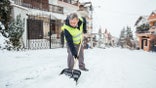 Older senior man shoveling snow - heart health risks