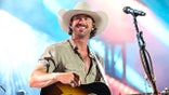 Riley Green playing guitar and singing at CMA Fest 2025