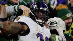 Ravens ride Derrick Henry's four touchdowns to keep playoff hopes alive