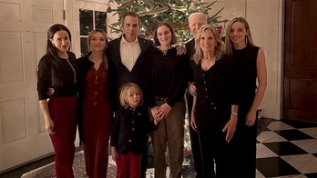 Biden nearly invisible in own Christmas family photo as Hunter takes center stage position