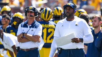 Former Michigan coach Jim Harbaugh reacts to Sherrone Moore's firing and charges