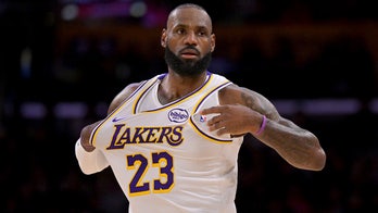 LeBron James accused of working on his 'golf swing' during national anthem