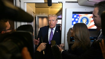 Trump mocks CBS reporter on Air Force One as he defends MRI results