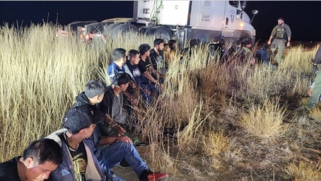Video shows 23 illegal immigrants found hidden in truck cab during tense traffic stop: police