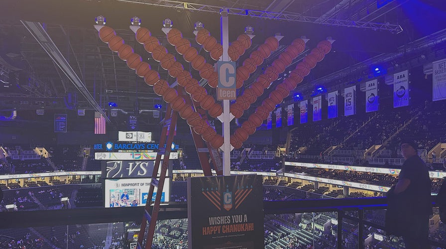 Nets honor Australia Hanukkah attack victims, light menorah