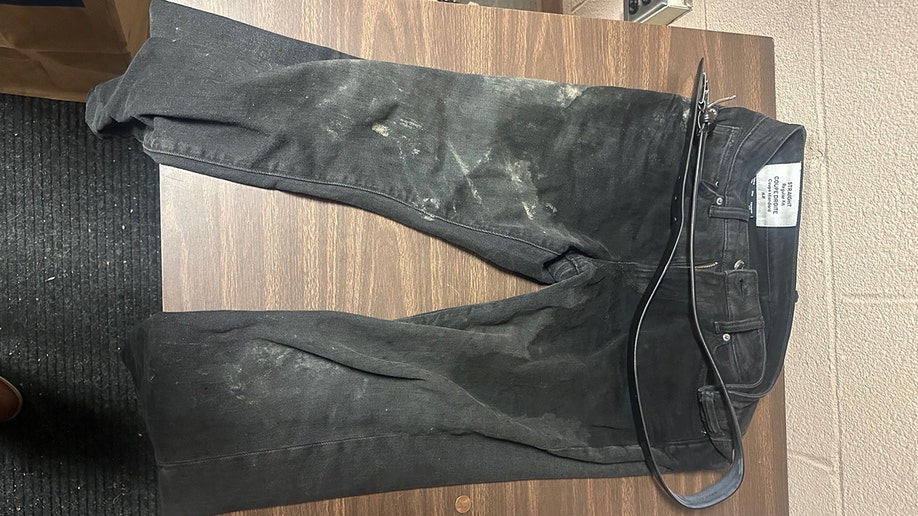 Evidence photos of Luigi Mangione's achromatic  pants from the apprehension  for UnitedHealthcare CEO Brian Thompson murder