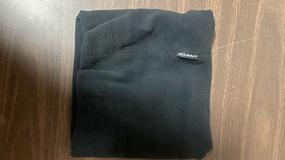 Evidence photos of Luigi Mangione's cervix  scarf from the apprehension  for UnitedHealthcare CEO Brian Thompson murder