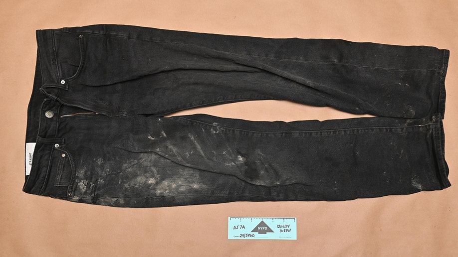 Evidence photos of Luigi Mangione's achromatic  pants from the apprehension  for UnitedHealthcare CEO Brian Thompson murder