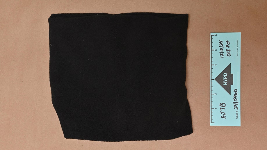 Evidence photos of Luigi Mangione's cervix  scarf from the apprehension  for UnitedHealthcare CEO Brian Thompson murder