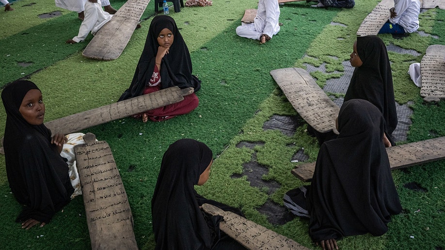 Young girls study the Quran in Somalia.