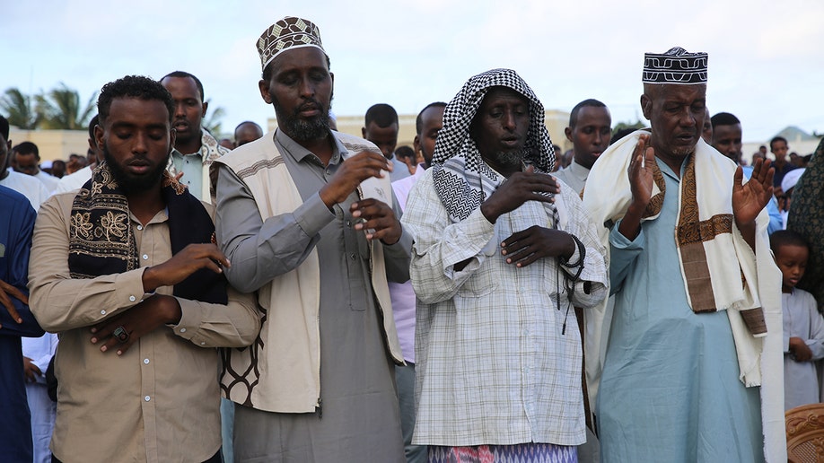 Men praying during Muslim festival in Somalia.