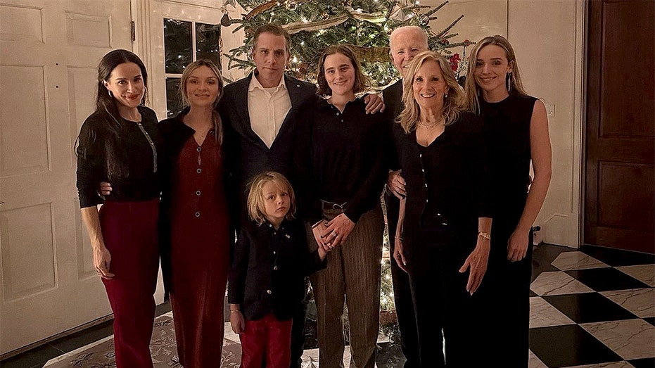 Biden nearly invisible in own Christmas family photo as Hunter takes center stage position