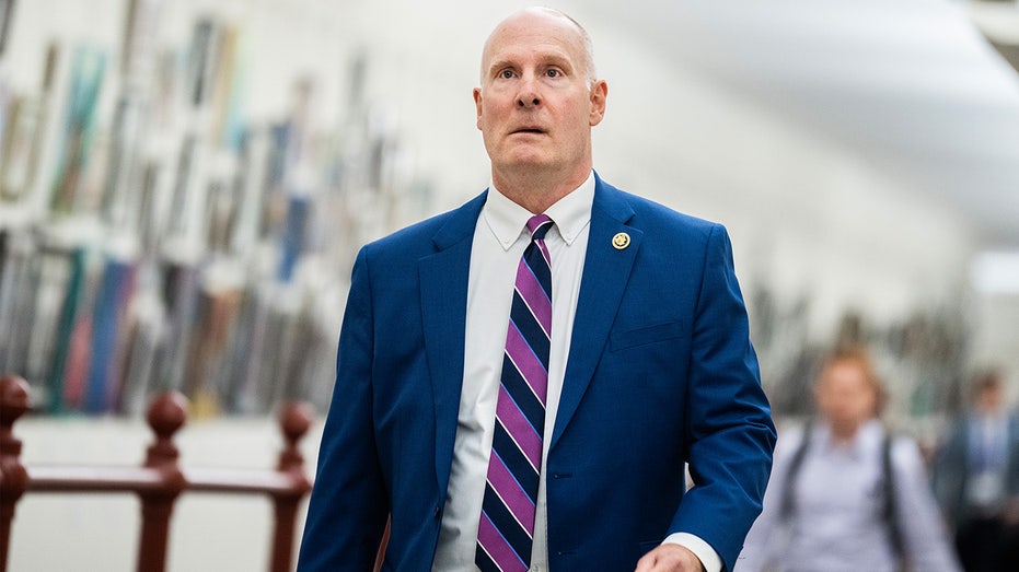Internet InfoMedia john moolenaar walks down hallway