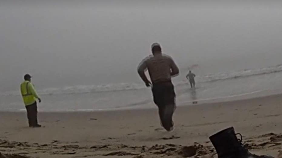 LA deputies caught on camera racing into foggy ocean to rescue disoriented paragliders