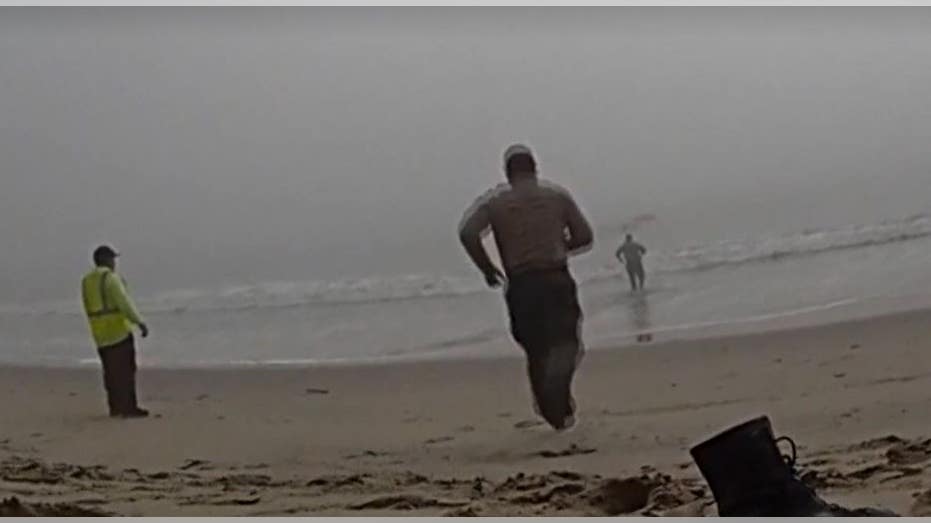 LA deputies caught on camera racing into foggy ocean to rescue disoriented paragliders