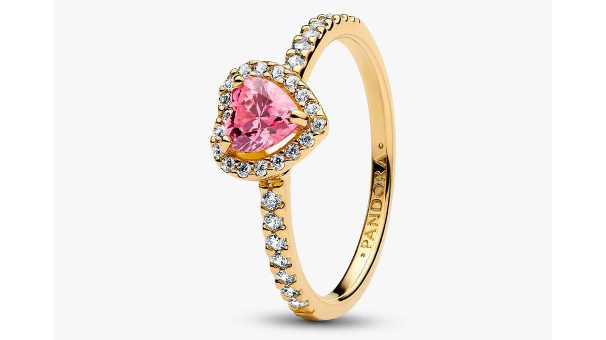This affordable ring combines gold, faux diamonds and a pink heart.