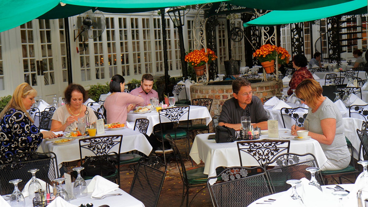 Customers dining at The Court of Two Sisters buffet in New Orleans, Louisiana.
