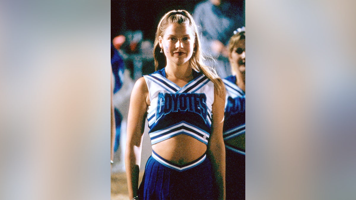 Ali Larter wearing a blue cheerleader uniform in "Varsity Blues."