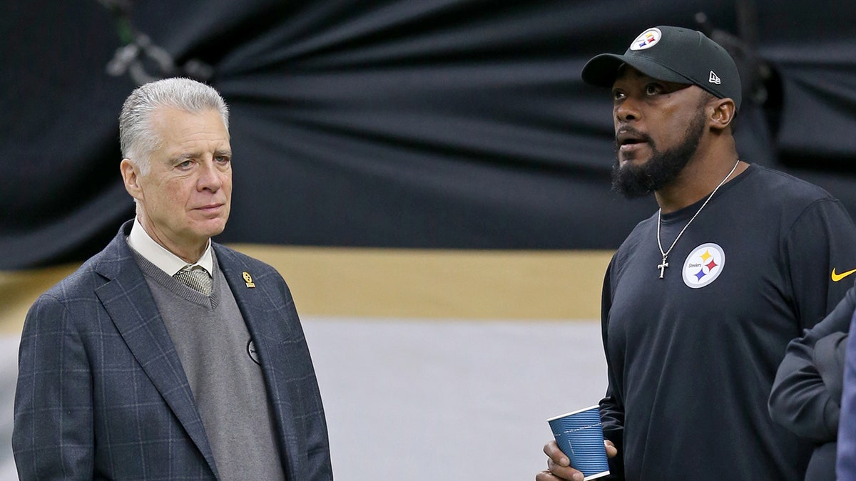 Art Rooney II and coach Mike Tomlin before a game