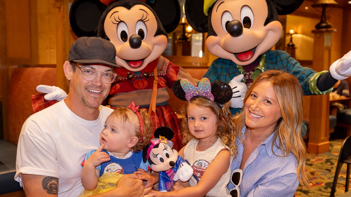 Ashley Tisdale at Disneyland with family