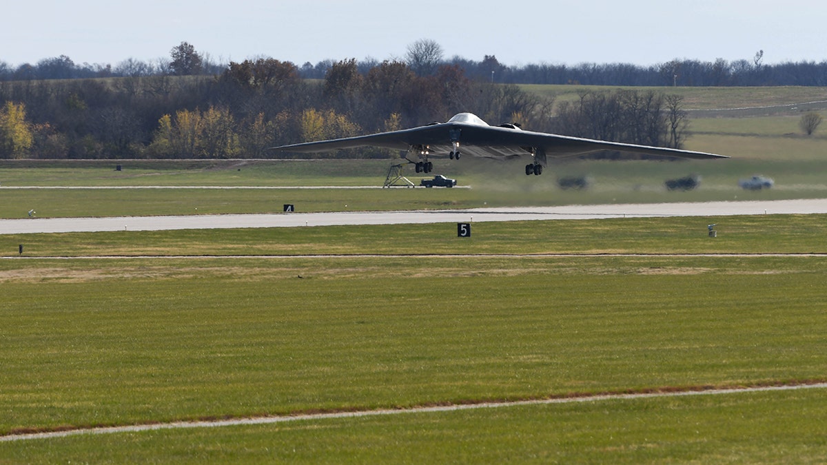 A B-2 spirit stealth bomber taking off field